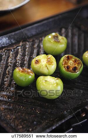 Stock Image - Grilled Tomatilloes. Fotosearch