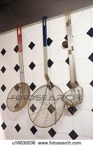 Stock Photograph - Hanging Kitchen Utensils. Fotosearch