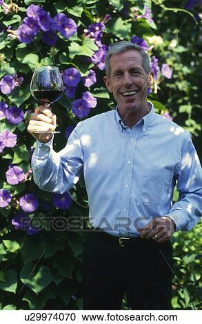 Man with glass of wine View Large Photo Image Stock Image - Man with glass of wine. Fotosearch