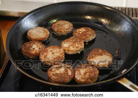 Stock Photo - Meet Patties in Pan. Fotosearch