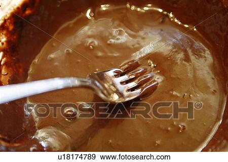 Melted Chocolate and fork View Large Photo Image Stock Photo - Melted Chocolate and fork. Fotosearch