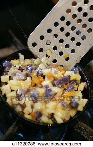 Stock Photograph - Mini Skillet with Potato and Onion. Fotosearch