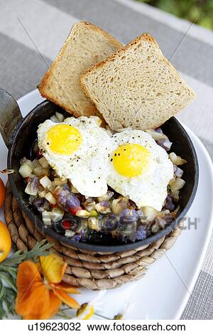 Stock Image - Mini Toast, Hash Browns and Sunnyside-up Quail Eggs. Fotosearch