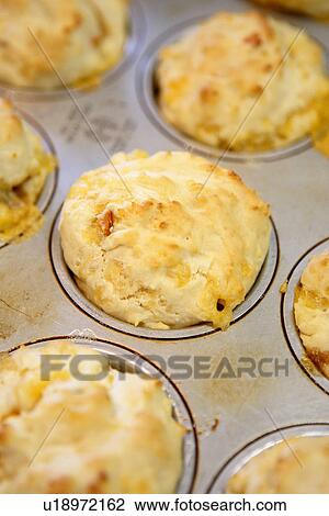 Stock Image - Muffins in a baking pan. Fotosearch