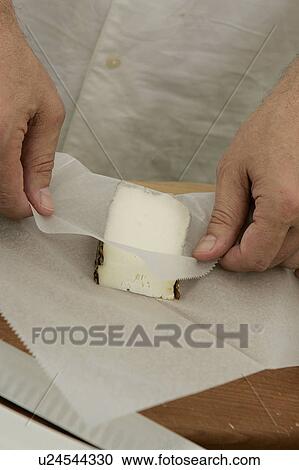 Stock Image - Packing Cheese at Farmers Market. Fotosearch