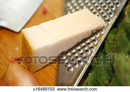 Stock Image - Parmesan and Grater. Fotosearch