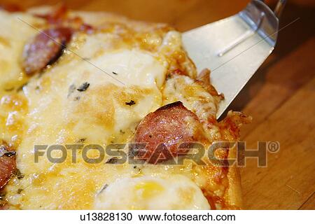 Pepperoni Pizza and Spatula View Large Photo Image Stock Image - Pepperoni Pizza and Spatula. Fotosearch