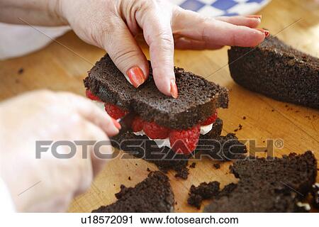 Preparing Chocolate Sandwich with Raspberries View Large Photo Image Stock Image - Preparing Chocolate Sandwich with Raspberries. Fotosearch