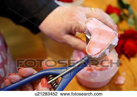 Stock Image - Preparing Heart-Shaped Rose Petal Sorbet. Fotosearch