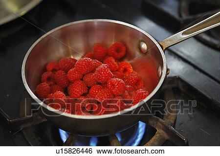 Stock Photograph - Raspberries in Pan / step shot. Fotosearch