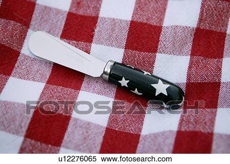 Stock Photography - Red and White Picnic Blanket with Butter Knife. Fotosearch