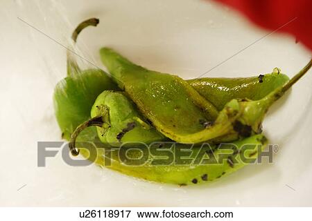 Rinsing Grilled Green Chili Pepper / Step shot View Large Photo Image Stock Photo - Rinsing Grilled Green Chili Pepper / Step shot. Fotosearch