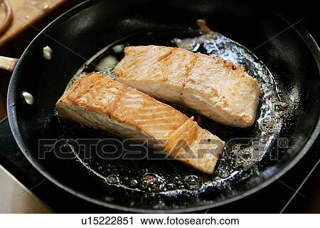 Salmon frying in a Pan View Large Photo Image Stock Image - Salmon frying in a Pan. Fotosearch