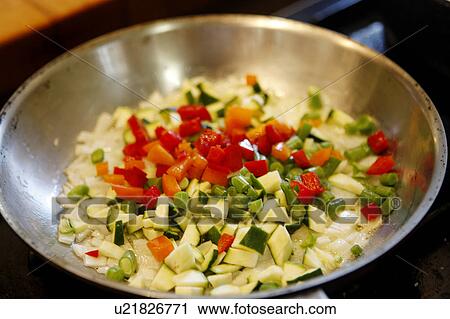 Stock Image - Scallions and Peppers in Pan. Fotosearch