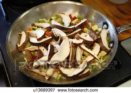 Stock Photo - Shitake Mushrooms, Scallions and Peppers in Pan. Fotosearch