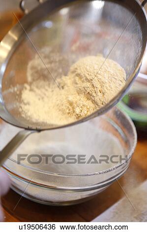 Sifting Flour / Step shot View Large Photo Image Stock Photograph - Sifting Flour / Step shot. Fotosearch