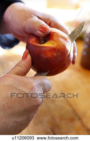 Stock Image - Slicing a Peach. Fotosearch