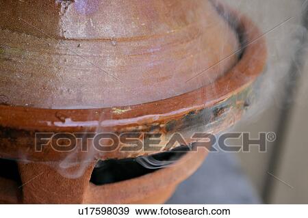 Steam escaping from a closed tajine dish View Large Photo Image Stock Photo - Steam escaping from a closed tajine dish. Fotosearch