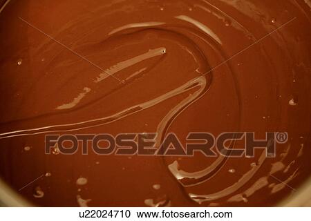 Stock Image - Swirled Melted Chocolate Sauce. Fotosearch