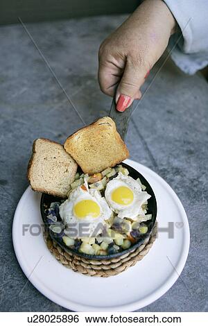 Toast, Hash Browns and Sunnyside-up Quail Eggs View Large Photo Image Stock Photograph - Toast, Hash Browns and Sunnyside-up Quail Eggs. Fotosearch