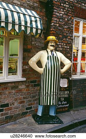 Wooden Figure outside of a London Café View Large Photo Image Stock Image - Wooden Figure outside of a London Café. Fotosearch