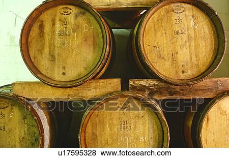 Wooden Wine Barrels stacked at a South African vineyard View Large Photo Image Stock Photo - Wooden Wine Barrels stacked at a South African vineyard. Fotosearch