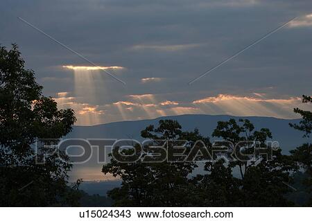 Stock Image -  shenandoah national park clouds streaming light. Fotosearch