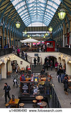 England, London, Covent Garden. Shops and restaurants in the covered ...