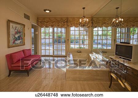 Bathtub with television in luxury room of a mansion View Large Photo Image Stock Photo - Bathtub with television in luxury room of a mansion. Fotosearch