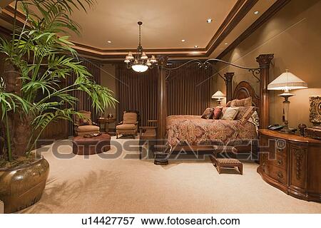 Stock Photo - Beautiful chandelier in bedroom of manor house. Fotosearch