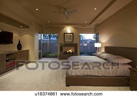 Stock Image - Bedroom with big window in manor house. Fotosearch