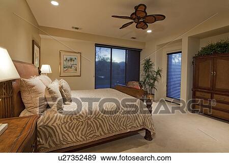 Bedroom with ceiling fan in manor house View Large Photo Image Stock Photo - Bedroom with ceiling fan in manor house. Fotosearch
