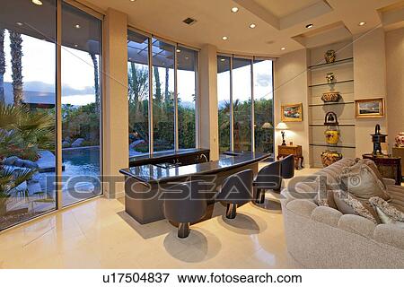 Chairs along counter near window in living room of mansion View Large Photo Image Stock Photo - Chairs along counter near window in living room of mansion. Fotosearch