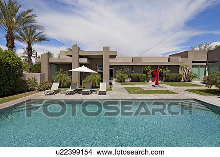 Chaise lounge at poolside in luxurious mansion View Large Photo Image Picture - Chaise lounge at poolside in luxurious mansion. Fotosearch