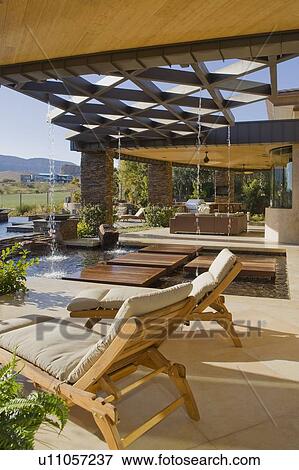 Chaise lounge in luxury patio of mansion View Large Photo Image Stock Photo - Chaise lounge in luxury patio of mansion. Fotosearch