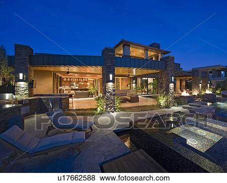 Chaise lounge near hot tub in front of luxury villa View Large Photo Image Stock Photo - Chaise lounge near hot tub in front of luxury villa. Fotosearch