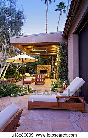 Chaise lounge with sunshade in patio of luxury villa View Large Photo Image Stock Photo - Chaise lounge with sunshade in patio of luxury villa. Fotosearch