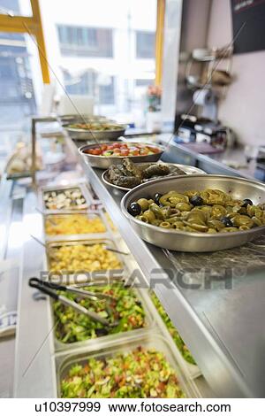 Close-up of food displayed on counter View Large Photo Image Stock Photo - Close-up of food displayed on counter. Fotosearch