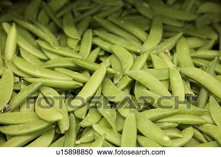Stock Image - Close-up of green peas in farmer's market. Fotosearch