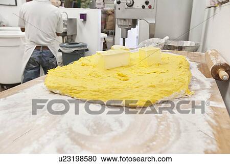 Close-up of yellow dough in bakery View Large Photo Image Stock Image - Close-up of yellow dough in bakery. Fotosearch