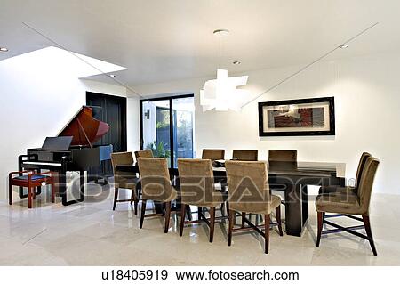 Stock Photo - Contemporary dining room in modern mansion. Fotosearch