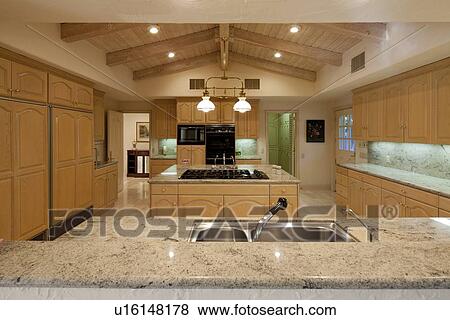 Contemporary kitchen counter in luxury house View Large Photo Image Stock Photo - Contemporary kitchen counter in luxury house. Fotosearch