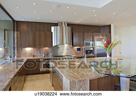Picture - Contemporary kitchen counter in mansion. Fotosearch
