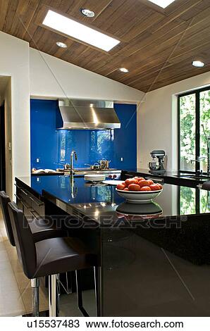 Stock Image - Contemporary kitchen counter of luxury villa. Fotosearch