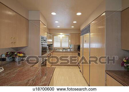 Stock Image - Contemporary kitchen interior of luxury house. Fotosearch