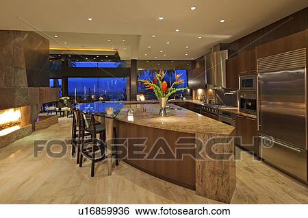 Contemporary kitchen of manor house under lights View Large Photo Image Stock Photograph - Contemporary kitchen of manor house under lights. Fotosearch