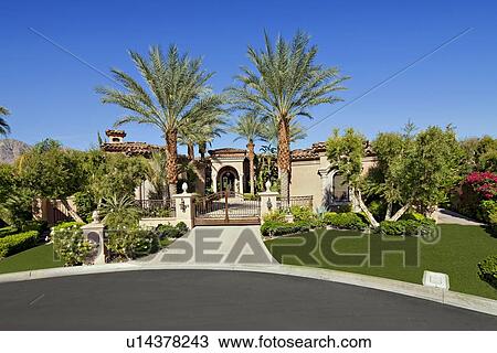 Stock Image - Entrance gate of luxury villa. Fotosearch