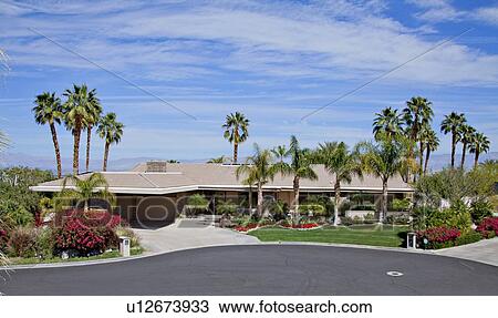 Stock Image - Facade of luxury country house. Fotosearch