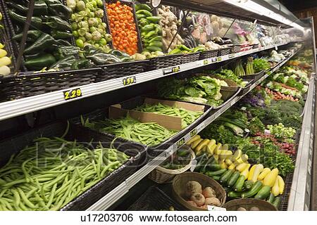 Fresh vegetables on display in farmer's market View Large Photo Image Stock Photograph - Fresh vegetables on display in farmer's market. Fotosearch