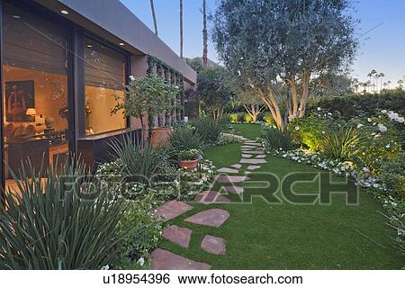 Stock Photograph - Garden outside luxury mansion. Fotosearch